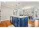 Eat-in kitchen with a large island, stainless steel appliances, and hardwood floors at 5019 Pleasant Run Dr, Matthews, NC 28104
