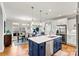 Modern kitchen with a large island, stainless steel appliances, and white cabinets at 5019 Pleasant Run Dr, Matthews, NC 28104