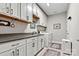 Bright laundry room with white cabinets and washer/dryer at 5019 Pleasant Run Dr, Matthews, NC 28104