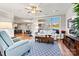 Light and airy living room with hardwood floors and large windows at 5019 Pleasant Run Dr, Matthews, NC 28104