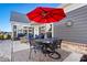 Private patio with seating, umbrella, and a dining table at 5019 Pleasant Run Dr, Matthews, NC 28104