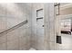 Large walk-in shower with tiled walls and grab bar at 5019 Pleasant Run Dr, Matthews, NC 28104