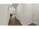 Bright hallway with hardwood floors and view to living area at 5149 Hyrule Dr, Charlotte, NC 28262