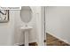 Modern powder room with pedestal sink and wood-look flooring at 5159 Hyrule Dr, Charlotte, NC 28262