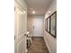 Bright entryway with wood-look flooring and built-in workspace at 5163 Hyrule Dr, Charlotte, NC 28262