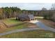 Brick ranch home with detached garage and expansive fenced backyard, offering a tranquil country setting at 7812 Hwy 742 Hwy, Marshville, NC 28103