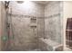 Modern tiled shower with bench, glass door, and rainfall showerhead at 7812 Hwy 742 Hwy, Marshville, NC 28103