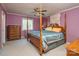 Large bedroom with four-poster bed, dresser, and carpeted floors at 7812 Hwy 742 Hwy, Marshville, NC 28103