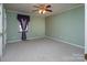 Spacious green bedroom with ceiling fan and carpeted floors at 7812 Hwy 742 Hwy, Marshville, NC 28103