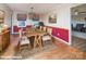 A dining room featuring wood floors, a stylish chandelier, and a wooden dining table at 7812 Hwy 742 Hwy, Marshville, NC 28103