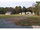 Gravel driveway leading to several outbuildings and a barn at 7812 Hwy 742 Hwy, Marshville, NC 28103