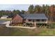 Brick home with front porch, landscaping, and a spacious driveway, offering curb appeal at 7812 Hwy 742 Hwy, Marshville, NC 28103