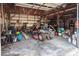 Garage interior with storage, lawn equipment, ATVs, and workspace at 7812 Hwy 742 Hwy, Marshville, NC 28103