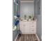 Compact laundry room with white cabinets, granite countertop, and utility sink at 7812 Hwy 742 Hwy, Marshville, NC 28103
