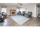Living room with fireplace, comfortable seating, and wood-look flooring at 7812 Hwy 742 Hwy, Marshville, NC 28103