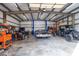 Large workshop with a car lift, tools, and classic cars at 7812 Hwy 742 Hwy, Marshville, NC 28103