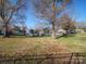 Spacious backyard with mature trees and open space at 904 S Main St, Landis, NC 28088