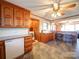 Kitchen with wood cabinets, tile floor and laundry area at 904 S Main St, Landis, NC 28088