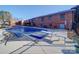 Covered pool with diving board and concrete surround at 904 S Main St, Landis, NC 28088