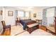 Serene blue bedroom with matching patterned curtains, furniture, and hardwood floors at 130 21St Nw Ave, Hickory, NC 28601