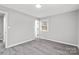 Empty bedroom with gray walls and gray wood-look flooring at 1433 Southridge St, Shelby, NC 28152