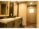 Double vanity bathroom with a modern design and neutral tones at 145 Eastgate Dr, Statesville, NC 28625