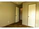 Simple bedroom with wood-look floors and hallway access at 145 Eastgate Dr, Statesville, NC 28625