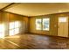 Spacious living room featuring wood-look floors and built-in shelving at 145 Eastgate Dr, Statesville, NC 28625