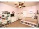 bedroom with a ceiling fan, white bed, desk, and dresser at 152 Stacybrook Se Dr, Concord, NC 28025