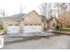 Charming two-story brick home with three-car garage and landscaped yard at 152 Stacybrook Se Dr, Concord, NC 28025