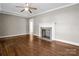 Living room with hardwood floors and fireplace at 1586 Kings Rd, Shelby, NC 28150