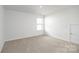 Spacious bedroom with window, closet, and neutral walls at 185 Giant Oak Ave, Statesville, NC 28677