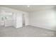 Spacious bedroom with neutral carpet and access to hallway and closet at 185 Giant Oak Ave, Statesville, NC 28677