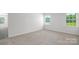 Spacious bedroom with neutral carpeting and large windows at 185 Giant Oak Ave, Statesville, NC 28677