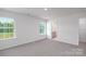 Bedroom with carpet, large windows, and access to a bathroom and closet at 185 Giant Oak Ave, Statesville, NC 28677