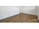 Bright hallway with hardwood floors and neutral paint at 185 Giant Oak Ave, Statesville, NC 28677