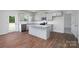 Eat-in kitchen featuring hardwood floors, island, and stainless steel appliances at 185 Giant Oak Ave, Statesville, NC 28677
