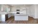 Modern kitchen with island, stainless steel appliances, and hardwood floors at 185 Giant Oak Ave, Statesville, NC 28677
