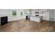 Open living room with hardwood floors and a cozy gas fireplace at 185 Giant Oak Ave, Statesville, NC 28677