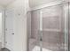 Spacious walk-in shower with built-in bench and tile surround at 4032 Bufflehead Dr, Charlotte, NC 28269