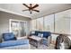 Relaxing screened porch with wicker furniture and ceiling fan at 502 Berrybeth Cir, China Grove, NC 28023