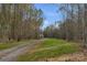 Long driveway leading to a house nestled in the woods at 791 S Grove St, Lincolnton, NC 28092