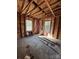 Unfinished bedroom with exposed framing, insulation, and two windows at 915 Mt Gallant Rd, Rock Hill, SC 29730