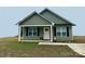 Charming one-story house with green siding, white door, and small front porch at Tbd Harley St, Wadesboro, NC 28170