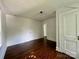 Empty bedroom with hardwood floors and white walls, ready for personalization at 1201 Central Dr, Kannapolis, NC 28083