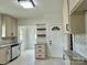 Bright and airy kitchen with white cabinetry, granite countertops, and a breakfast nook at 1201 Central Dr, Kannapolis, NC 28083