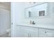 Clean bathroom with white cabinets, quartz countertop, and a modern faucet at 1220 Lomax Ave, Charlotte, NC 28211