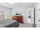 Well-appointed bedroom with a plush bed, dresser, and a view into the hallway at 12310 Delcorte Ln, Pineville, NC 28134