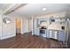 Open-concept kitchen with stainless steel appliances and wood-look flooring at 1235 Bradford Heights Rd, Gastonia, NC 28054