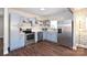 Modern kitchen with stainless steel appliances, gray cabinets, and wood-look flooring at 1235 Bradford Heights Rd, Gastonia, NC 28054